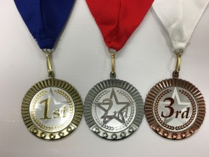 Neck drape and medal colors for 1st, 2nd, and 3rd places.