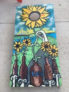 This awesome board was painted with love! The bean bags go through the center of the sunflower.